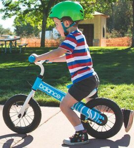 Balance bike - as per its name's sake, teaches balance!